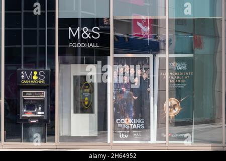 High Wycombe, England - July 21st 2021: Marks and Spencer's Foodhall amd cash machine. The store has a presence in most large towns. Stock Photo