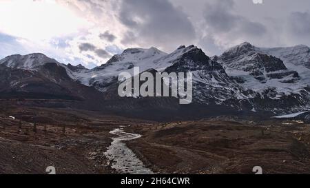 View of snow-capped Mount Athabasca in Jasper National Park, Alberta, Canada in the Rocky Mountains with Athabasca River in the rocky glacial moraine. Stock Photo