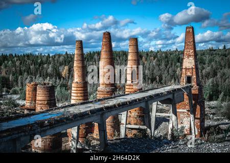 Ruins of an abandoned marble factory and lime kilns in Ruskeala Mountain Park. Karelia, Russia. Black and white. Stock Photo