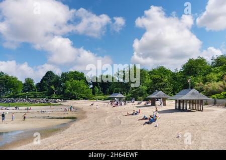 Old Greenwich, CT, USA-August 2020: Panoramic view over the beach of Greenwich Point Park or Tods Point with number of people enjoying the beach and s Stock Photo