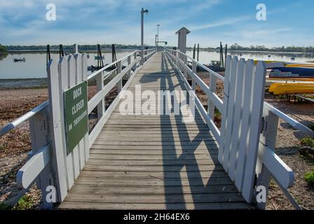 Old Greenwich, CT, USA-August 2020; View of the dock of Greenwich Yacht Club on Tods Point with the water of Greenwich Cove in the background Stock Photo