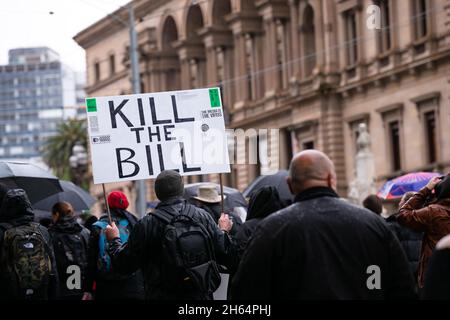 Melbourne, Australia. 13 November, 2021. A Kill the Bill placard is seen during an anti Andrew's Government protest at the State Parliament steps in Melbourne. Thousands of protesters endured the rain to fight against vaccine mandates as well as the Andrews Governments draconian Pandemic Bill. Credit: Dave Hewison/Speed Media/Alamy Live News