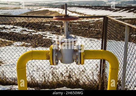 Gas pipe with valve for opening and closing the supply. Stock Photo