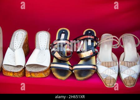 Vintage women's shoes on a red background. Stock Photo