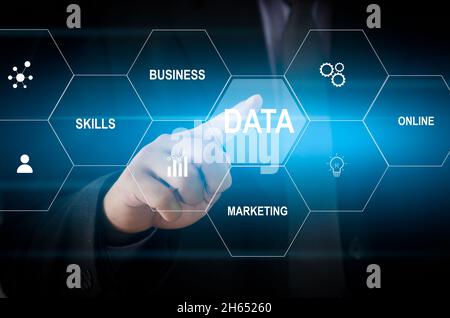 Man hand touching data word with icon business virtual screen concept. Stock Photo