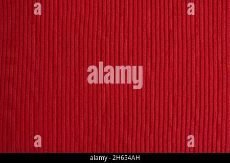 Red knitted fabric texture as background Stock Photo