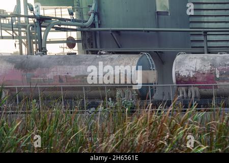 Set of tanks with oil and fuel transport by rail. Freight cars and trains in Southeast Asia Stock Photo