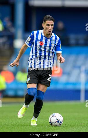 Theo Corbeanu #23 of Sheffield Wednesday runs forward with the ball ...