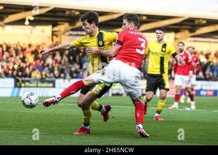 Burton Albion's Thomas O'Connor (left) and Charlton Athletic's Ben Purrington (right) battle for the ball during the Sky Bet League One match at Pirelli Stadium, Burton. Picture date: Saturday November 13, 2021. Stock Photo