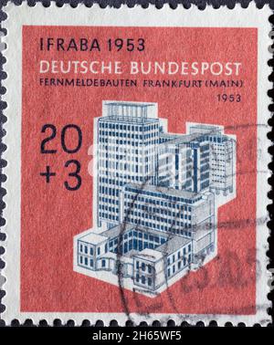 GERMANY - CIRCA 1951The telephone company building in Frankfurt (river Main) Germany 1953 can be seen on this postage stamp printed in Germany. The po Stock Photo