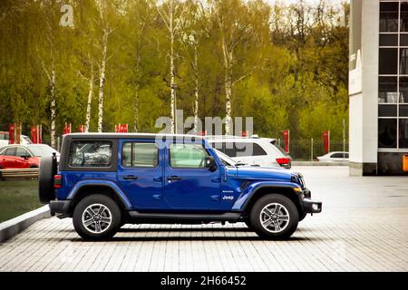 Kiev, Ukraine - April 21, 2020: Blue SUV Jeep Sahara in the city. Side view Stock Photo
