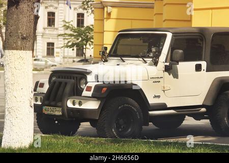 Kiev, Ukraine - May 3, 2019: Jeep Wrangler SUV near the church Stock Photo