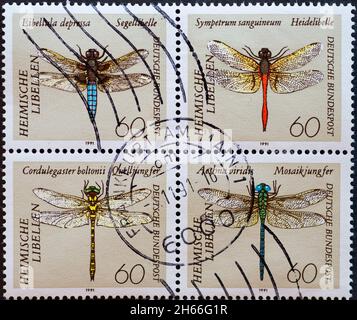 GERMANY - CIRCA 1991 a postage stamp from Germany, showing Large dragonflies in the overprint of stamps. Libellula depressa, Cordulegaster boltonii, S Stock Photo