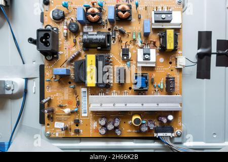 Exposed Electronic control unit and connection ports of a LCD television Stock Photo