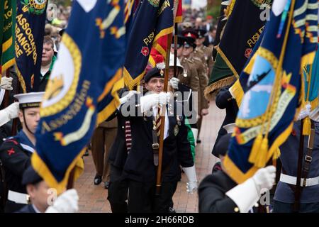 The 100th Bedworth armistice parade taking place on November 11th 2021. The parade makes it's way through the town centre towards the wreath laying ceremony in the cemetery. Stock Photo