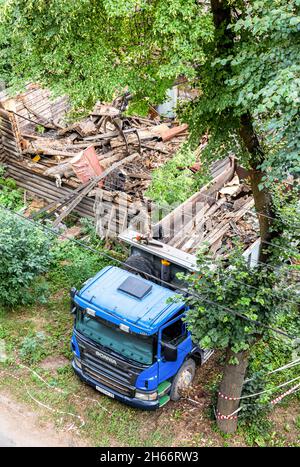 Novgorod, Russia - July 2, 2021: Demolition of an old wooden house. Wreckage of an old destroyed wooden house Stock Photo