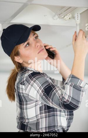 architect at the construction site making a phone call Stock Photo