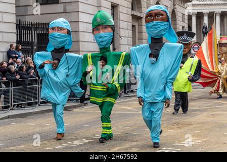 CITY OF LONDON SOLICITORS’ COMPANY, with THANKING KEY WORKERS float at the Lord Mayor's Show, Parade, procession passing along Poultry. NHS characters Stock Photo