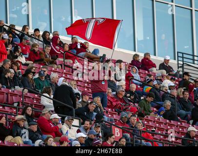 Troy, Alabama, USA. 13th Nov, 2021. A Troy Trojans fan waves the teams colors after a field goal during an NCAA football game between the Troy Trojans and the Louisiana-Lafayette Ragin Cajuns at Veterans Memorial Stadium in Troy, Alabama. Brandon Sumrall/CSM/Alamy Live News Stock Photo