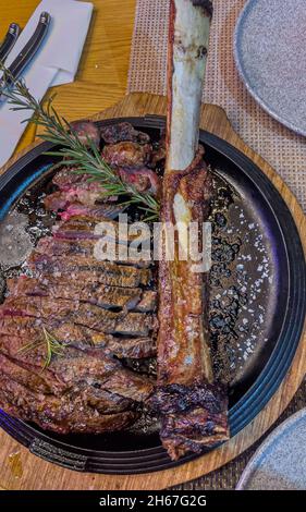 Delicious aged grilled sliced angus tomahawk ready to be eaten Stock Photo