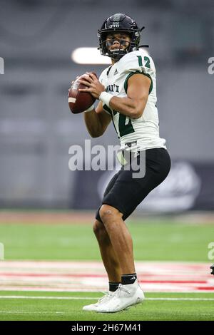 November 13, 2021: Hawaii Warriors quarterback Chevan Cordeiro (12) drops back to pass during the football during the NCAA football game featuring the Hawaii Warriors and the UNLV Rebels at Allegiant Stadium in Las Vegas, NV. The UNLV Rebels and the Hawaii Warriors are tied at halftime 10 to 10. Christopher Trim/CSM. Stock Photo