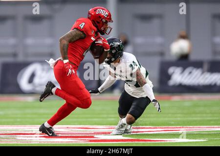 November 13, 2021: Hawaii Warriors wide receiver Jalen Walthall (4) avoids a tackled by Hawaii Warriors defensive back Kai Kaneshiro (24) during the NCAA football game featuring the Hawaii Warriors and the UNLV Rebels at Allegiant Stadium in Las Vegas, NV. The UNLV Rebels and the Hawaii Warriors are tied at halftime 10 to 10. Christopher Trim/CSM. Stock Photo