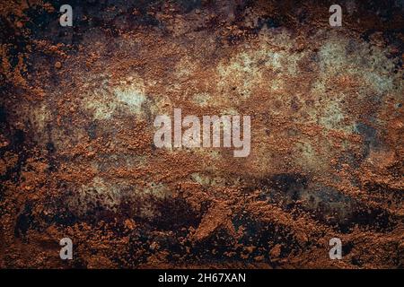 Grungy Texture of Brown Dirt on Distressed Metal: Brown dirt brushed across a weathered metal surface Stock Photo