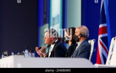 Glasgow, UK. 13th Nov, 2021. COP26 President Alok Sharma (L) reacts during the closing plenary of the 26th session of the Conference of the Parties (COP26) to the United Nations Framework Convention on Climate Change in Glasgow, the United Kingdom, Nov. 13, 2021. The United Nations climate change conference concluded here Saturday after a one-day extension, with negotiators agreeing on a new global pact to tackle climate change. Credit: Han Yan/Xinhua/Alamy Live News Stock Photo