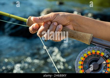 Holding fishing rods hi-res stock photography and images - Alamy