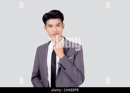 Portrait young asian business man in suit with smart thinking idea isolated on white background, businessman standing and planning for success, handso Stock Photo