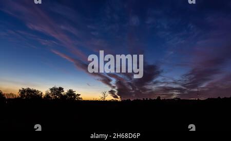 Bright contrasting blue sky with color gradient. Stock Photo