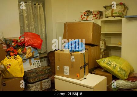 MILAN, ITALY - Sep 30, 2021: The home moving boxes packed in an apartment Stock Photo