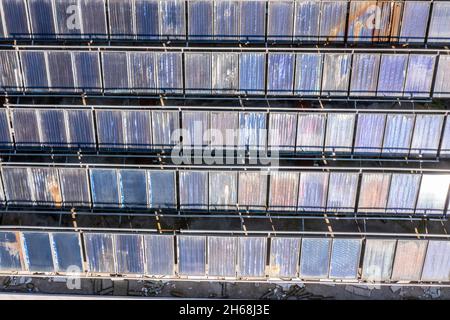 Aerial top view of old and dirty Solar energy panels. Clean and renewable energy concept for a sustainable ecosystem. High quality photo Stock Photo