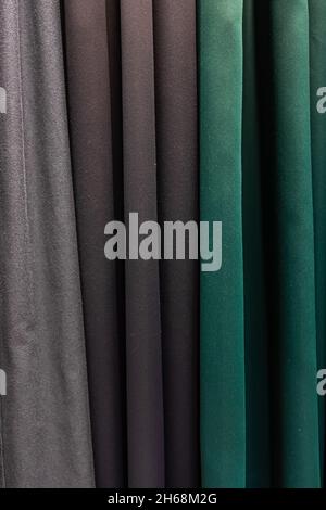 Set of dark multi-colored dense fabrics of uniform texture. Stock Photo
