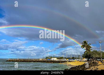 Honolulu, Hawaii - Nov 6, 2021-Double rainbow over beach in Oahu, Hawaii. Stock Photo