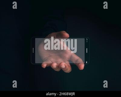Futuristic transparent glass phone Technology. Super slim transparent future smartphone with horizontal mock-up blank screen in hand on dark backgroun Stock Photo