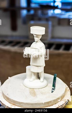 unglazed ceramic clay model of pottery worker with sager on head at Gladstone Pottery Museum, Longton, Stoke on trent Stock Photo