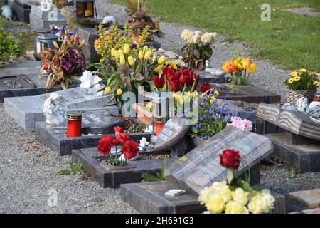 Tombs lavishly decorated with flowers Stock Photo