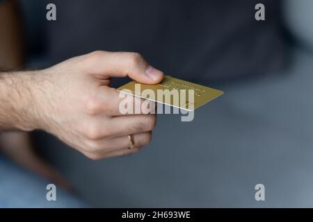 Close up young man paying with credit card. Stock Photo