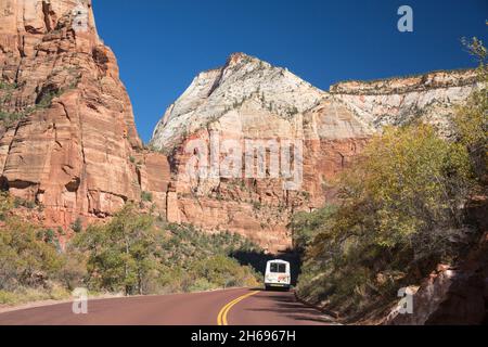 Zion National Park, Utah, USA. View along Zion Canyon Scenic Drive to Mount Baldy and Observation Point, autumn, shuttle bus passing Angels Landing. Stock Photo