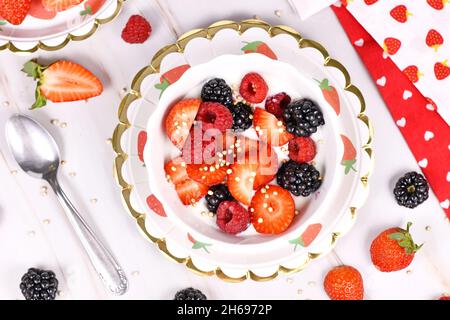 Top view of berry mix yogurt bowl with strawberry, raspberry and blackberry fruits and puffed quinoa Stock Photo