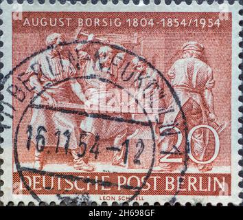 GERMANY, Berlin - CIRCA 1954: a postage stamp from Germany, Berlin showing Forge workers. 100th anniversary of August Borsig's death (1804-1854) Stock Photo