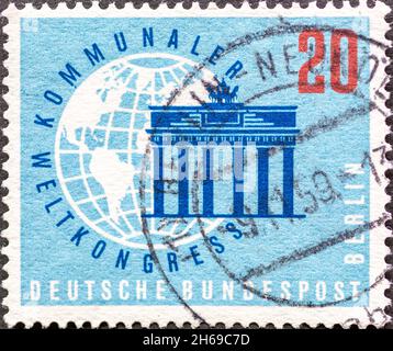 GERMANY, Berlin - CIRCA 1959: a postage stamp from Germany, Berlin showing the Brandenburg Gate with a globe. World Municipal Congress, Berlin Stock Photo