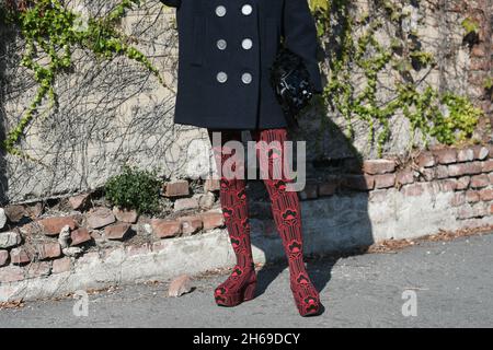 Milan, Italy - September 24, 2021:  Street style outfit, fashionable woman wearing Prada outfit on the streets of Milan, Italy. Stock Photo