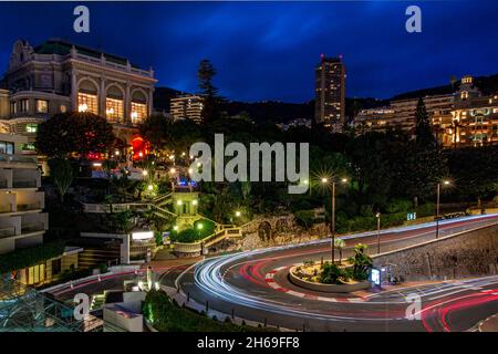 The famous hair pin bend on the formula one circuit in Monaco at night with the casino on the right hand side Stock Photo