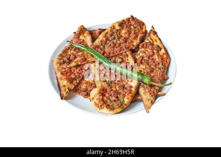 Overhead view on Turkish Pide on Plate  isolated on white with clipping path Stock Photo