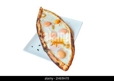 Overhead view on Turkish Pide on Plate  isolated on white with clipping path Stock Photo