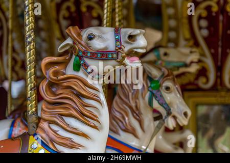 fairground horses, merry-go-round, traditional funfair horses, carousel horses at funfair, heritage funfair, traditional fairground ride, colourful. Stock Photo