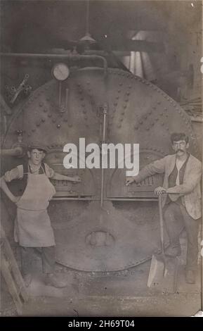 Older man working on steam engine Stock Photo - Alamy