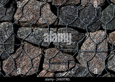 Texture or background wall of natural stone and wire Stock Photo